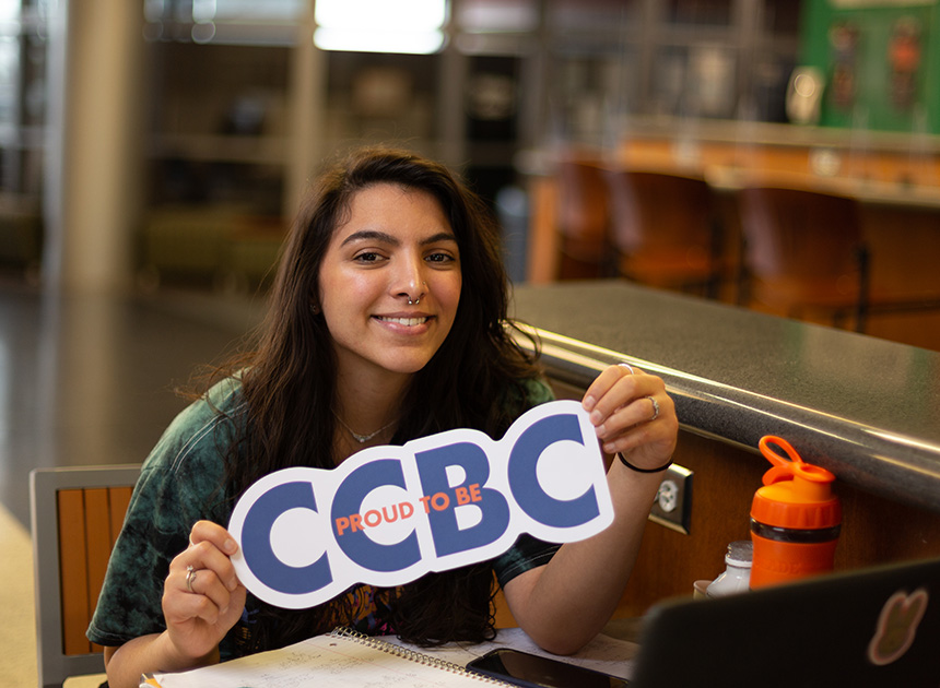 CCBC student holding a proud to be CCBC sign