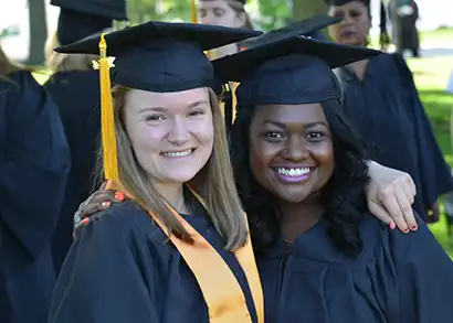 Two CCBC graduates smile for a photo