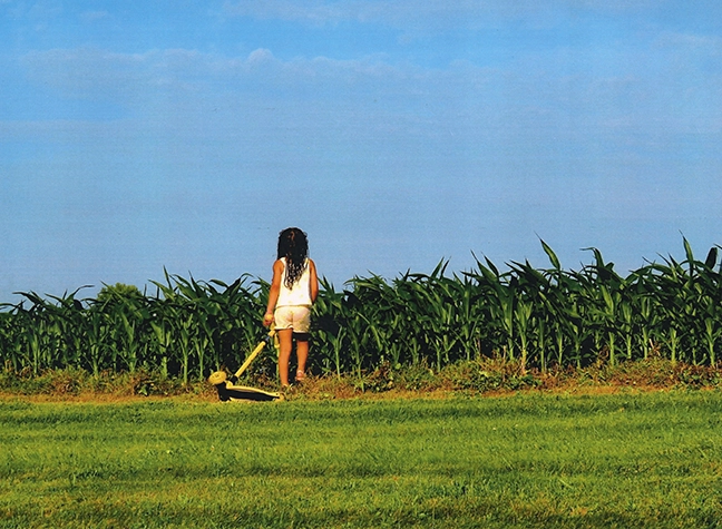 Little girl in corn field