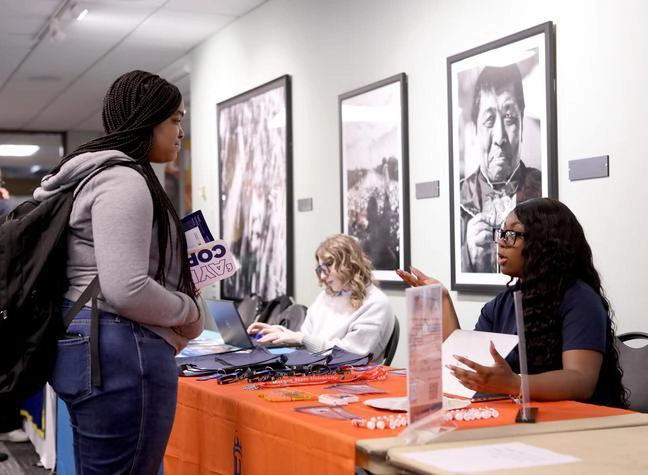 A Morgan State University admissions recruiter talks to a CCBC student.
