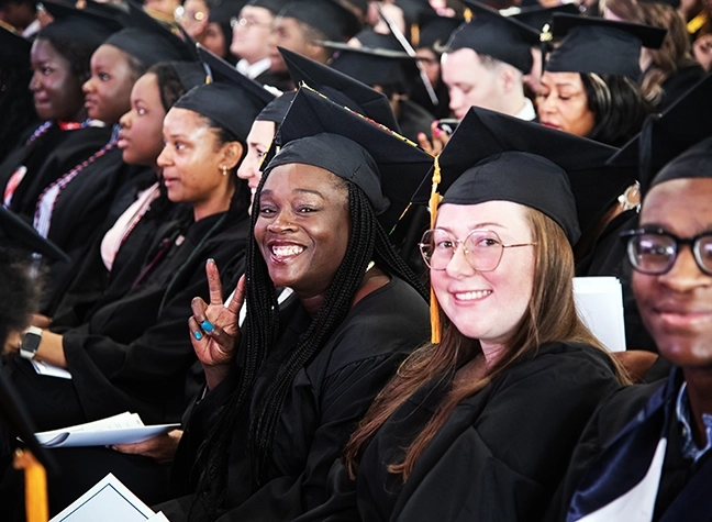 Students sit and wait in excitement to hear their name called at CCBC's commencement ceremony.