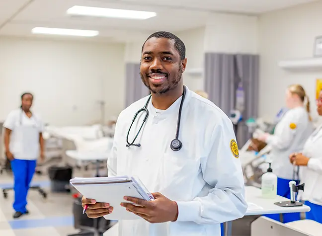 Female nursing student helping patient