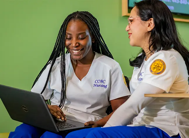 Female nursing student helping patient