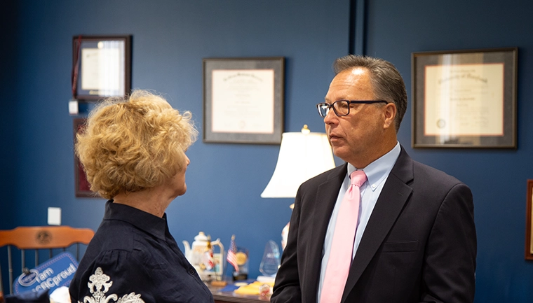 Michael Carper and President Dr. Sandra Kurtinitis