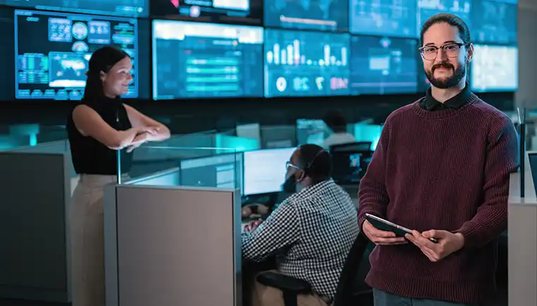 3 professionals working in computer lab