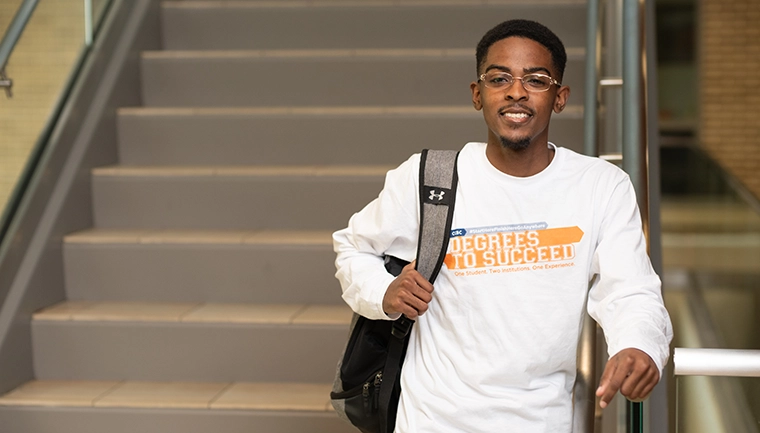Student wearing Degrees to Succeed Shirt