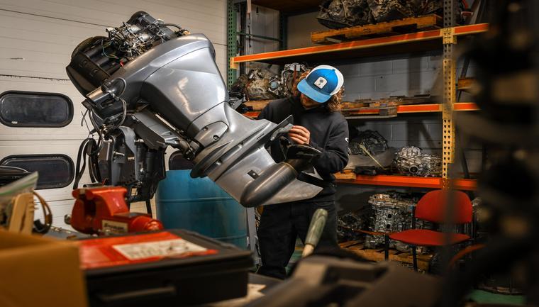 Workforce marine student working on a part