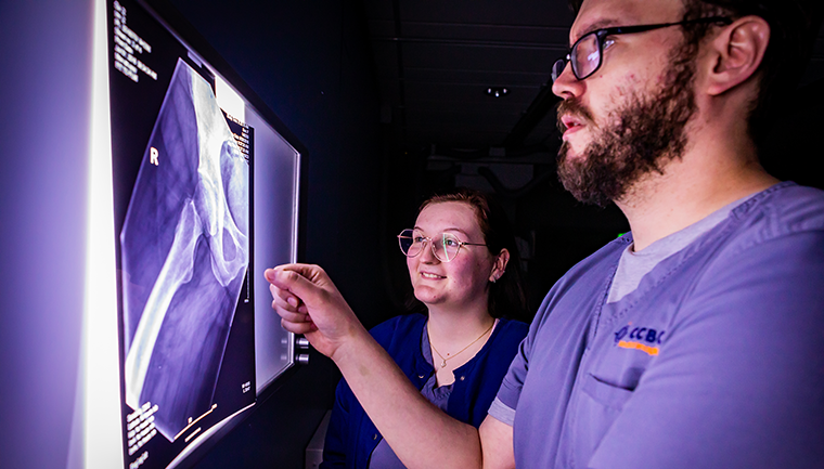 Student working with x-ray machine