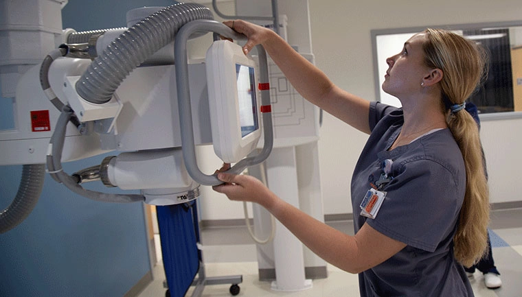 Student working with x-ray machine