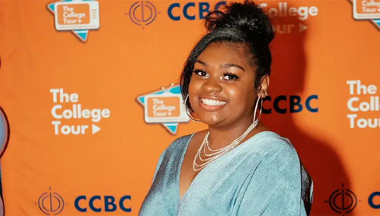 Asia Lee posing at The College Tour premiere