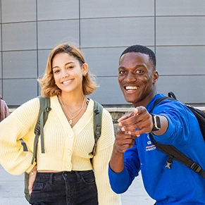 Two students pointing 