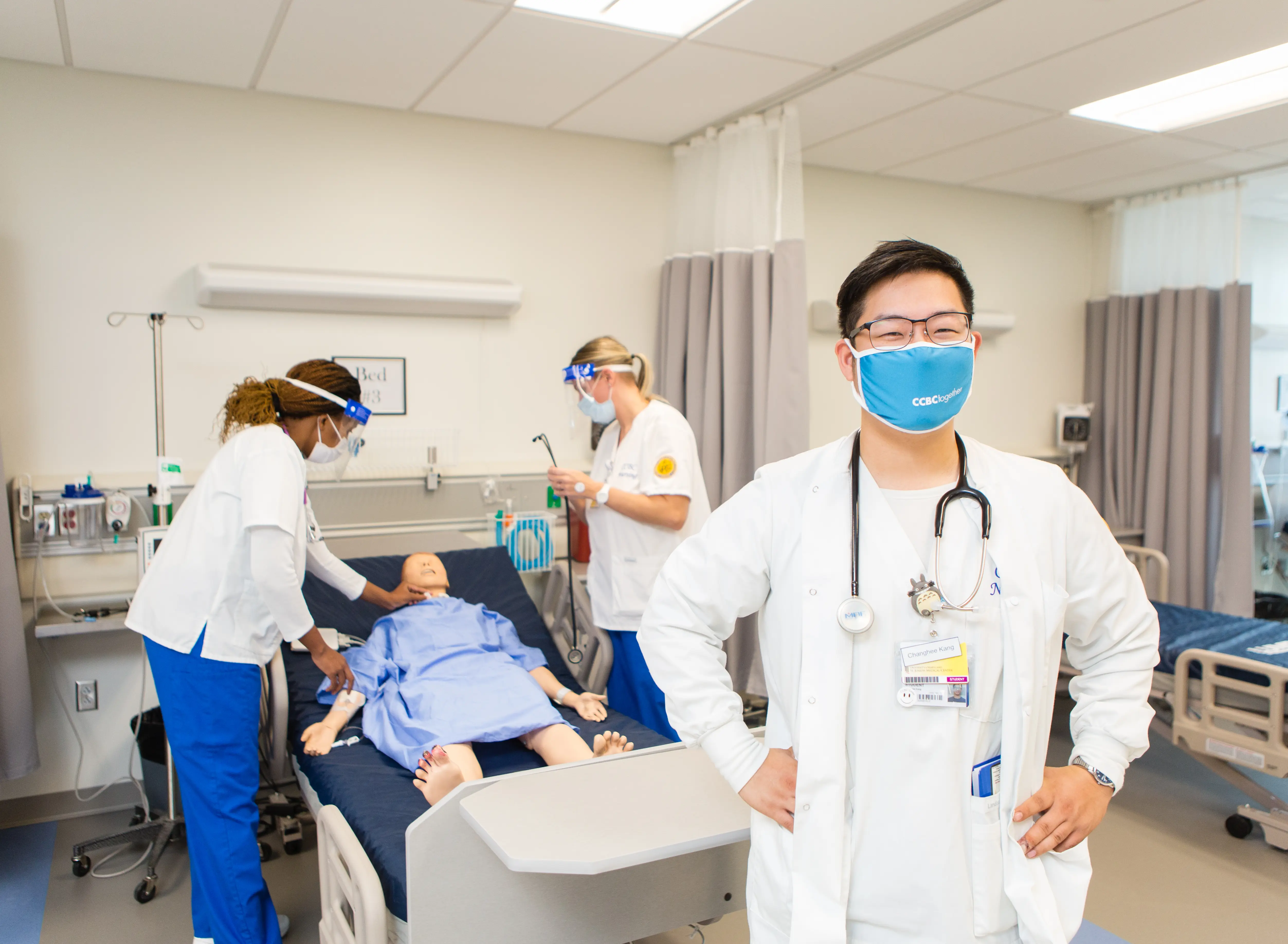 Photo of nurses practicing care.