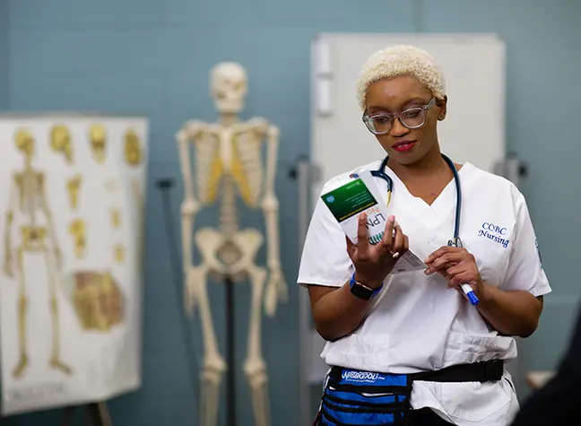 photo of LPN nurse reading brochure.