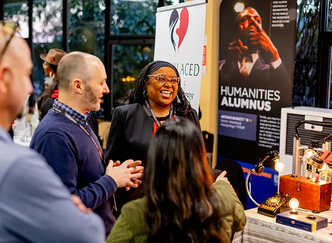 Photo of people talking at a career fair.