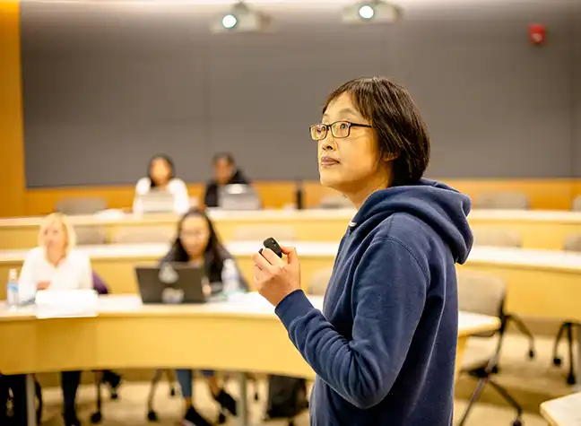 Professor teaching in front of class