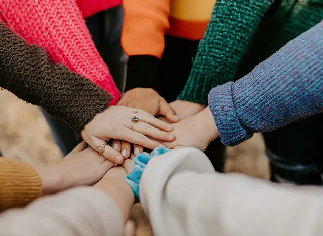 Photo of hands together.