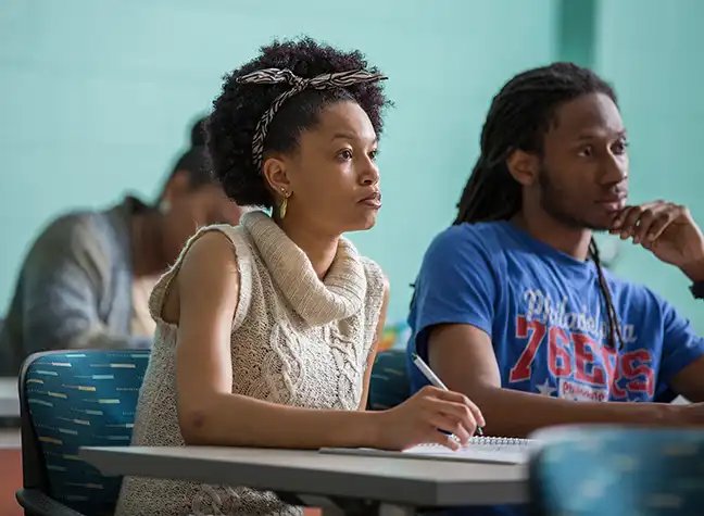 Female student listening intently in class