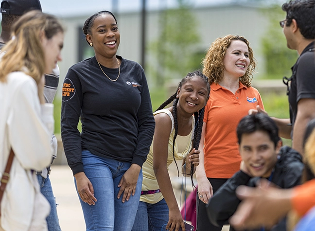 Group of students gathering together outside