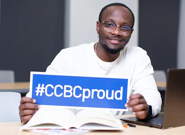 Student holding Proud to be CCBC sign
