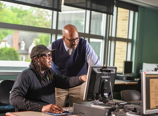 Job Network student in front of computer with instructor