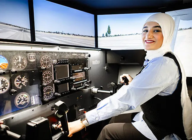 Student using the aircraft simulator