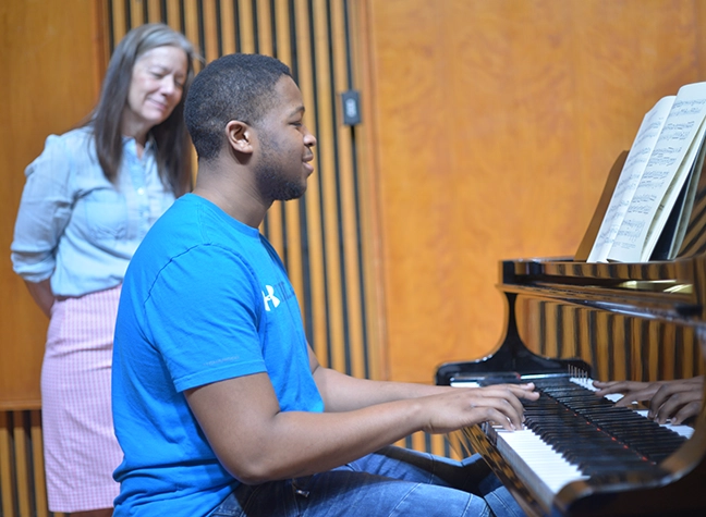 Student playing piano