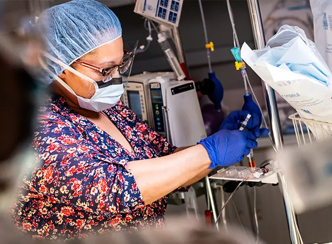 Female student in anesthesiology lab working