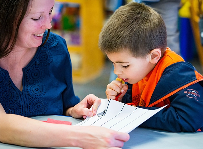 teacher and young child