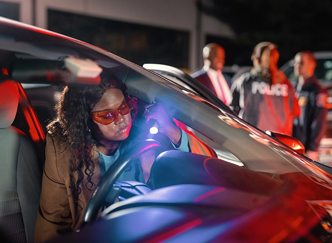 Woman investigating scene.