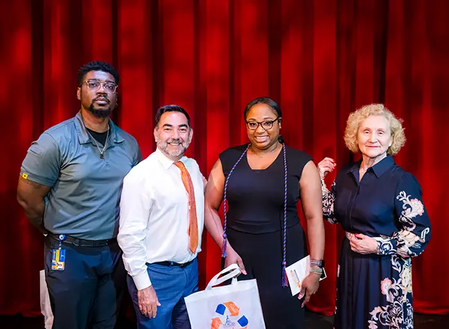 A Degrees to Succeed student standing with Dr. Sandra Kurtinitis.