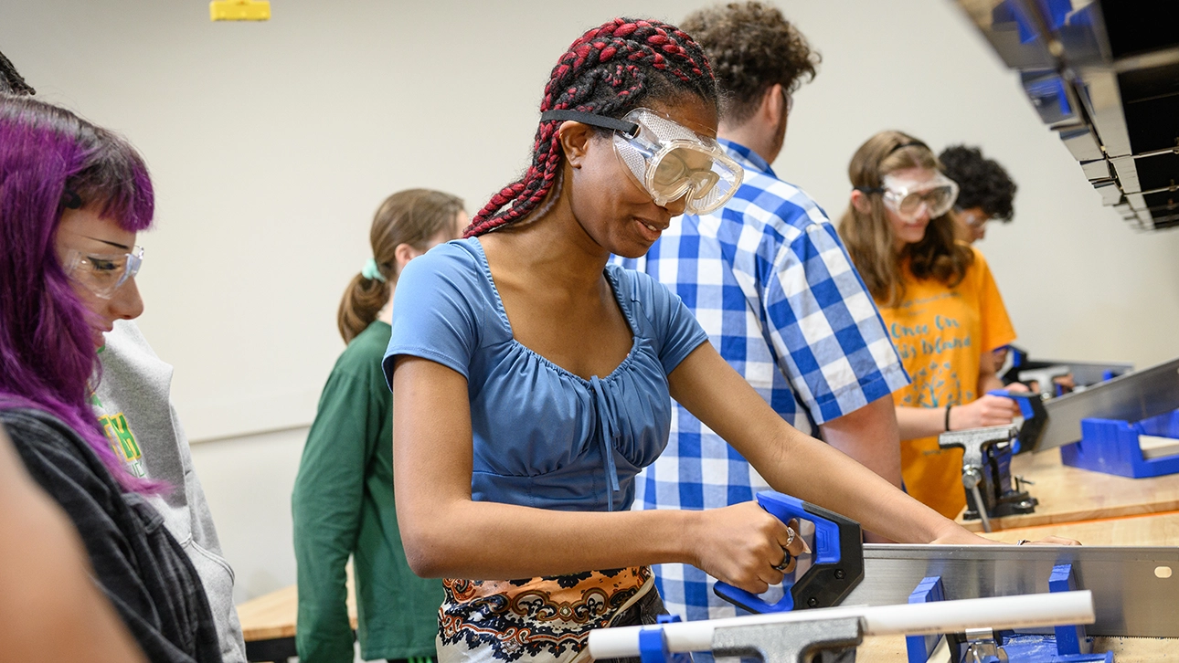 A ECAP student participating in a hands-on engineering workshop.