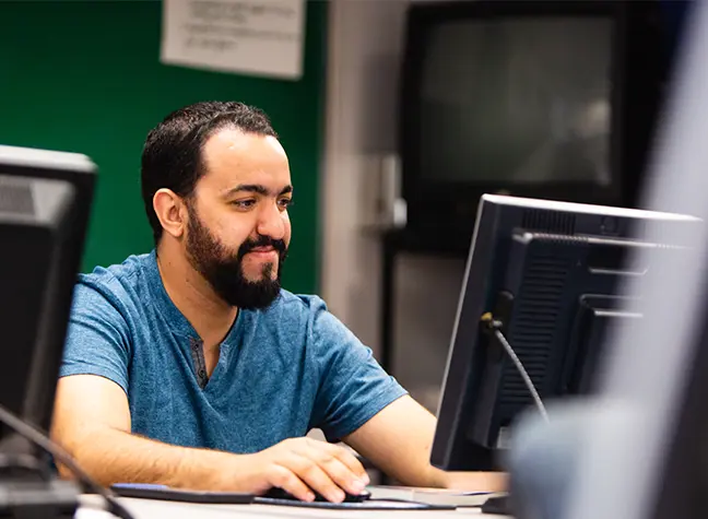 Student in computer lab using computer